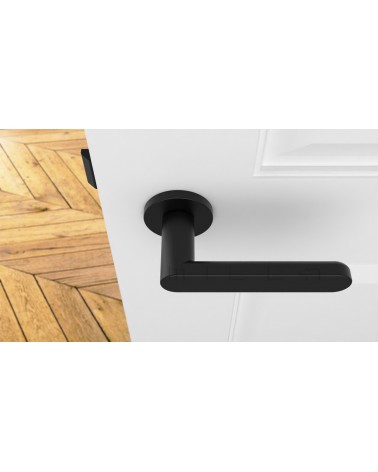 Puxador de porta preto ALORA puxador design vista de cima montado numa porta