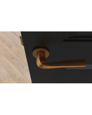 Puxador de porta cobre DALIA puxador design vista de cima montado numa porta