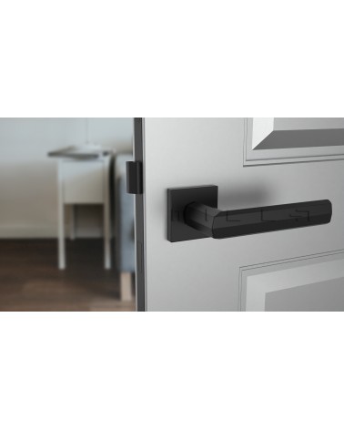 Puxador de porta preto FRESIA puxador design vista de frente montado numa porta