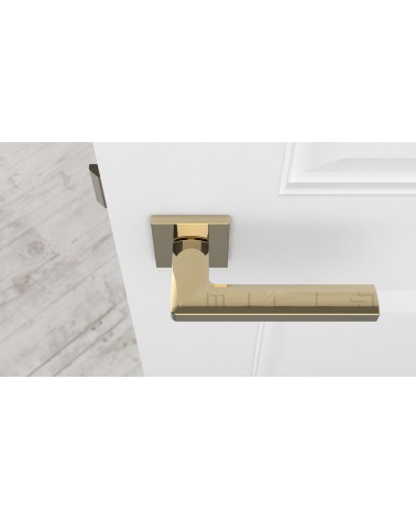 Puxador de porta ouro polido PYROLA ferragens design vista de cima montado numa porta