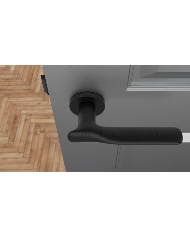 Puxador de porta preto ORCHIDE puxador design visto de cima montado numa porta