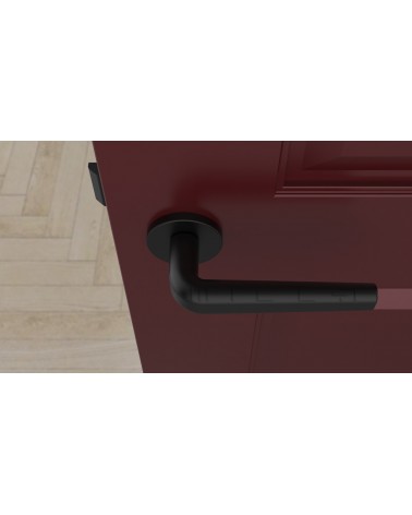 Puxador de porta preto INULLA puxador design vista de cima montado numa porta