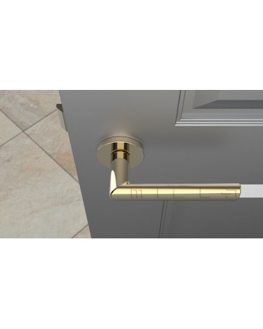 Puxador de porta ouro polido SILENA ferragens design vista de cima montado numa porta