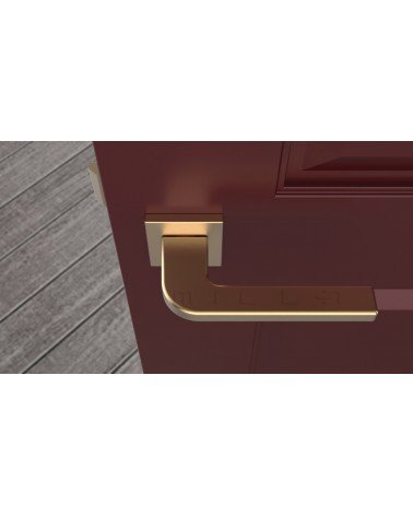 Puxador de porta dourado mate ISMENA puxador design visto de cima montado numa porta