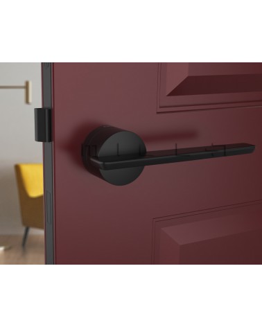 Puxador de porta futurista JUMELLE puxador design vista de frente montado numa porta