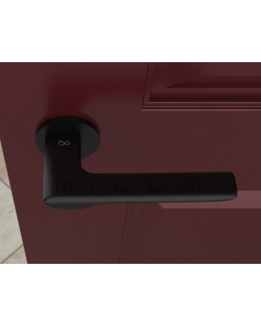 Puxador de porta preto LIGNE design vista de cima montado numa porta