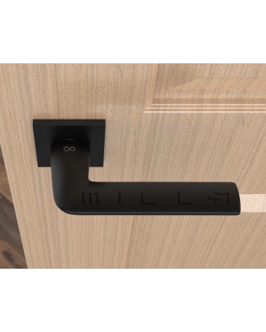Puxador de porta preto STINGER puxador design vista de cima montado numa porta