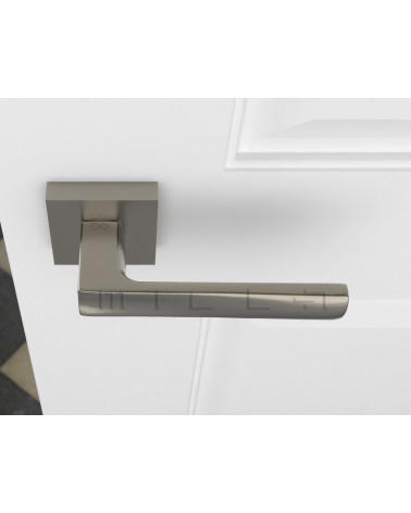 Puxador de porta níquel acetinado DIUNA puxador design vista de cima montado numa porta