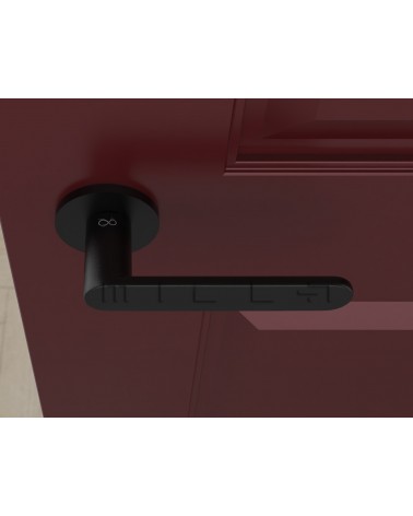 Puxador de porta preto Line Vénus design visto de cima montado numa porta