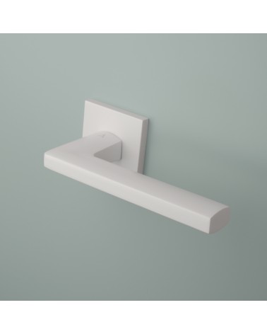 Puxador de porta em zamak PYROLA ferragens design montado numa porta