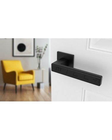 Puxador de porta em zamak TILLIA puxador design cor 1 vista de cima inclinada montado numa porta