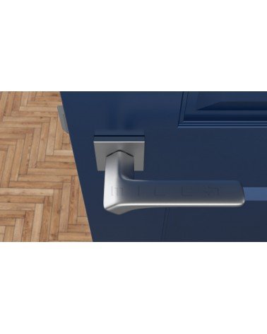Puxador de porta cromado acetinado BERGERIA ferragens design vista de cima montado numa porta