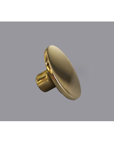 Botão de móvel dourado polido ASTRO puxador design sobre fundo cinzento