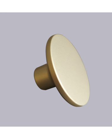 Puxador de móvel dourado mate ASTRO design de puxador sobre fundo cinzento