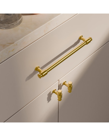 Puxador de móvel GALIUM dourado polido design vista de cima inclinada montado num móvel branco